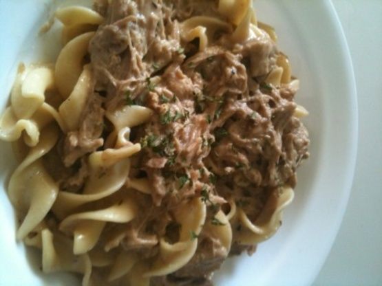 pasta with meat and sauce in a white bowl