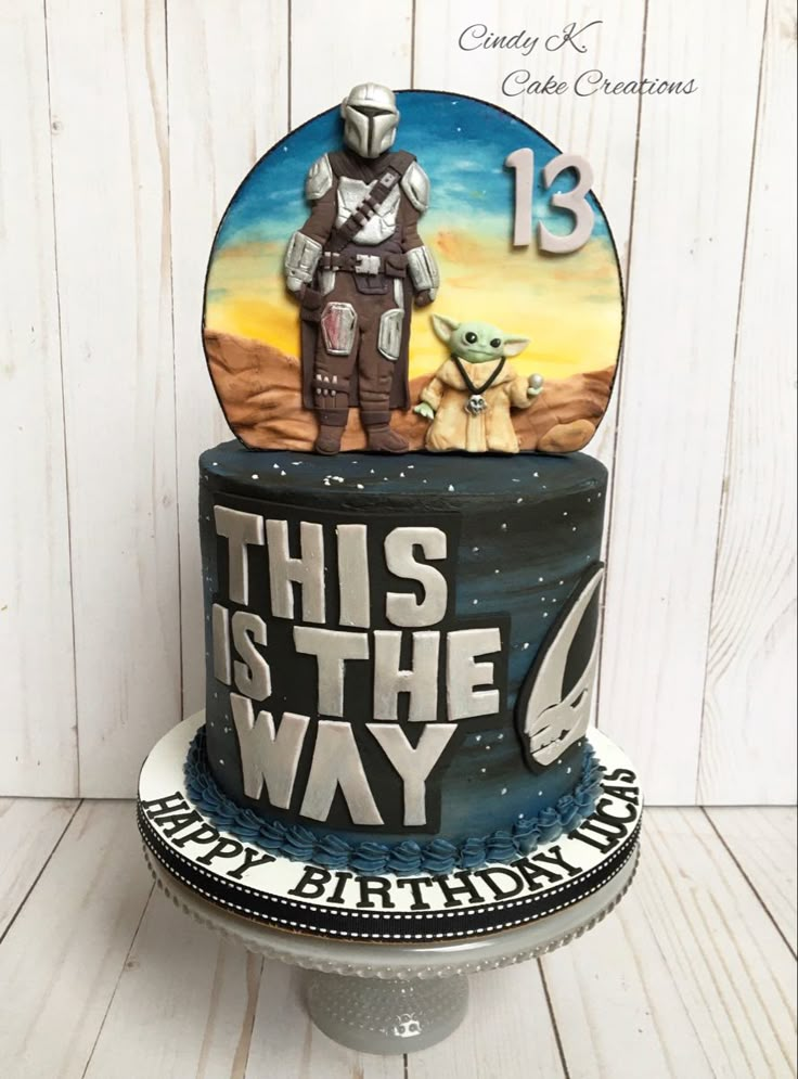 a star wars themed birthday cake with an image of yoda and baby yoda