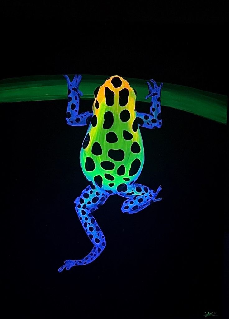 a brightly lit frog sitting on top of a green leaf