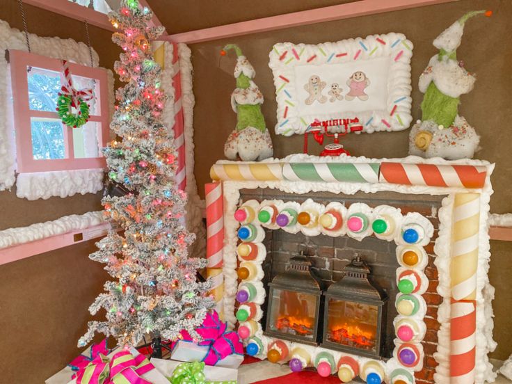 Welcome to our life-sized gingerbread house! Home to our gingerbread family, Dave, Sherry and Ginger, this gingerbread house was quite the project! It took 3 people 4 days and LOTS of foam insulation to put it together… and believe it or not is made from a bed frame! Watch Now! If you’re interested in creating … Gingerbread House Decorations Life Size, Candy Lights, Turtle Creek Lane, Sugarplum Christmas, Christmas Candyland, Candy Room, Candyland Theme, Gingerbread Tree, Diy Gingerbread