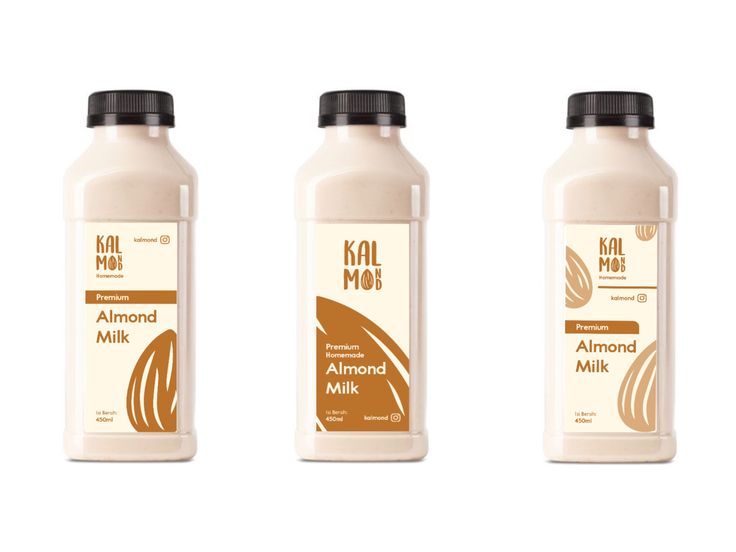 three bottles of almond milk on a white background