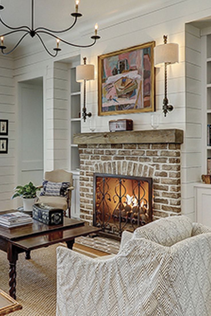 a living room filled with furniture and a fire place