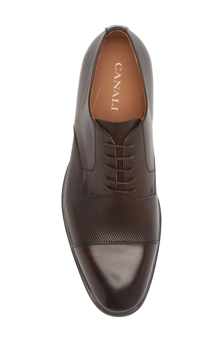 A streamlined silhouette brings polished style to an Italian-made derby finely crafted from smooth leather with perforation at the vamp. Leather upper and lining/rubber sole Made in Italy Fitted Leather Shoes With Perforated Toe Box For Business, Leather Oxfords With Perforated Toe Box For Work, Leather Oxfords With Perforated Toe Box For Semi-formal Occasions, Elegant Derby Shoes With Perforated Plain Toe, Luxury Business Oxfords With Perforated Toe Box, Elegant Derby Shoes With Perforated Toe For Business, Semi-formal Cap Toe Leather Shoes With Perforated Toe Box, Leather Oxfords With Perforated Toe Box For Business, Business Dress Shoes With Perforated Toe Box In Leather