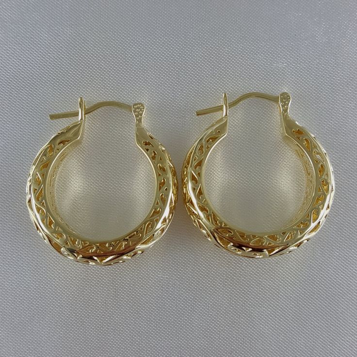 Step into the world of elegance and style with our stunning Gold Plated Filigree Hoop Earrings. Designed to make a statement, these earrings add a touch of glamour to any ensemble. Get ready to turn heads and feel fabulous!Inner diameter: 18mm - 11/16 in.Outer Diameter: 25mm - 1 in.Width at the bottom: 9mm - 3/8 in. Ornate Gold Filigree Hoop Earrings, Ornate Metal Filigree Hoop Earrings, Gold-plated Filigree Hoop Earrings, Festival Brass Filigree Hoop Earrings, Filigree Hoop Earrings, Gold Plate, Hoop Earrings, Plating, Floral