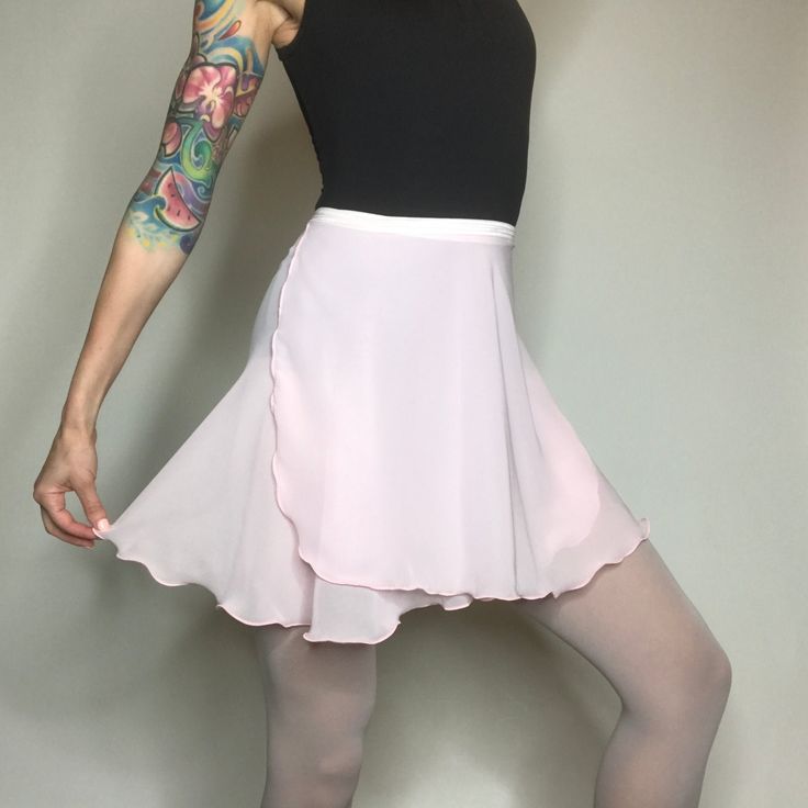 "Our original ballet wrap skirt, Classical Wraps are slightly longer in the back. They are made with a high quality, semi-translucent chiffon that is light weight with beautiful drape. The 5/8\" elasticized ribbon holds the skirt in place while you petite your way across the floor. For details on sizing & length, scroll down to the \"Sizing Information\" link." Fitted Asymmetrical Skort For Summer, Elegant Fitted Skort With Gathered Skirt, Fitted Solid Color Tiered Mini Skirt, Spring Ruffled Fitted Swim Skirt, Fitted Ruffled Swim Skirt For Spring, Spring Fitted Ruffled Swim Skirt, Fitted Mini Tennis Skirt With Ruffles, Spring Fitted Swim Skirt With Ruffles, Elegant Ruffled Flowy Skort