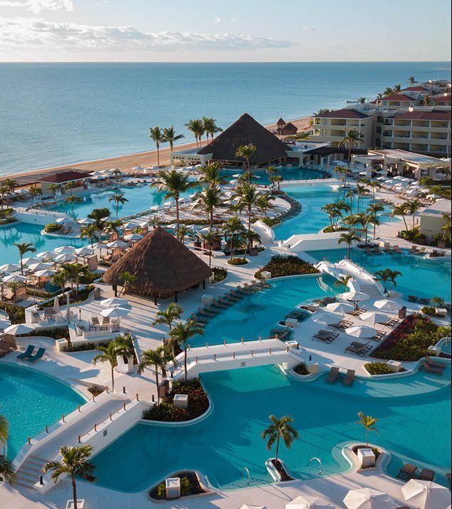 an aerial view of the pool and beach area at dreams resort in cancucilla, mexico