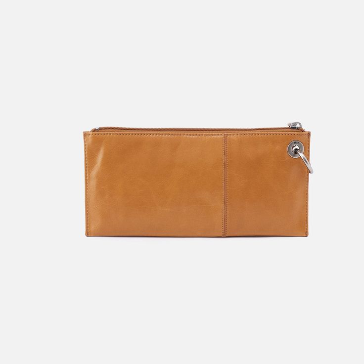 A best seller that's perfect for grab-and-go moments, our Vida clutch has a convenient wristlet strap and can double as an organizational pouch inside your HOBO bag. Modern Clutch Wristlet For Daily Use, Modern Wristlet Clutch For Daily Use, Classic Everyday Wristlet, Modern Clutch With Cell Phone Pocket, Versatile Brown Clutch With Card Slots, Modern Clutch With Card Slots For Daily Use, Modern Clutch For Daily Use With Card Slots, Modern Wristlet Clutch For Everyday Use, Rectangular Clutch With Card Slots For Daily Use