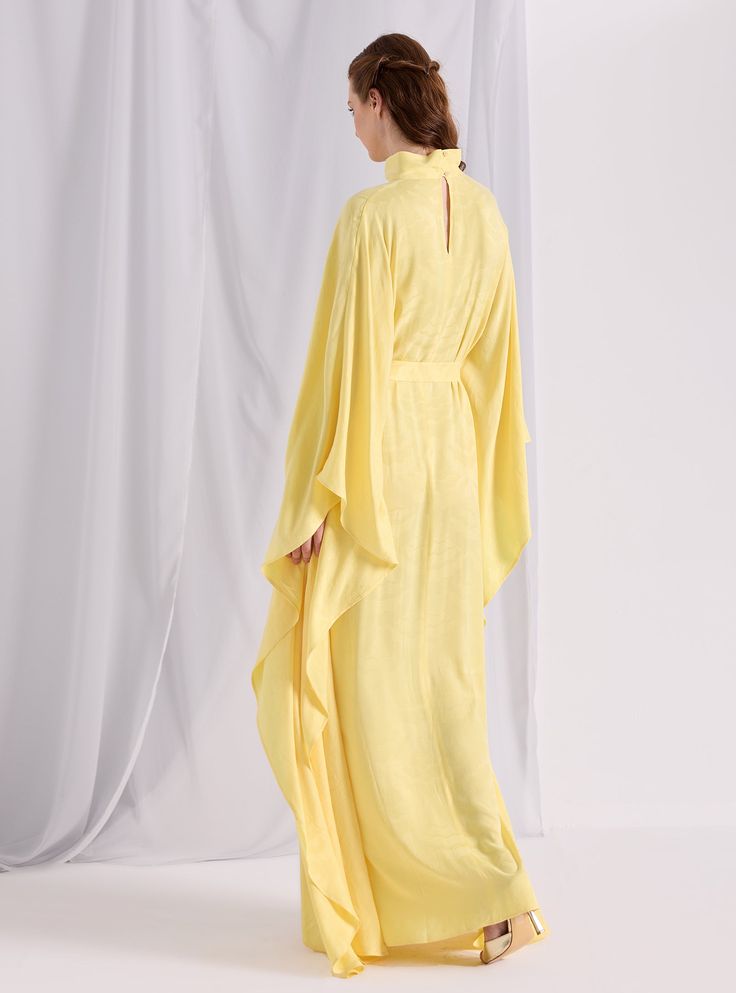 Model height: 177 CM 100% Viscose Length: 140cm Elegant Yellow Silk Kaftan, Silk Dresses With Kimono Sleeves, Fitted Maxi Length Kimono, Festive Chic Maxi Length Dresses, Festive Chic Maxi Dresses, Long Evening Gown For Spring, Silk Floor-length Kaftan For Formal Occasions, Long Silk Fitted Kaftan, Fitted Silk Long Kaftan