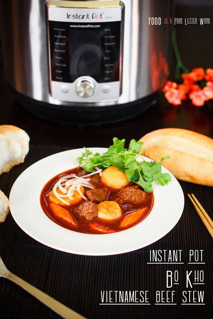 a white plate topped with meat and vegetables next to an instant pot pressure cooker