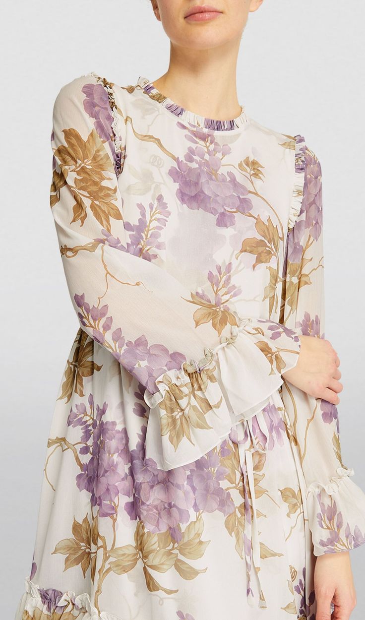 Made of luxuriously lightweight chiffon, this dress boasts a stunning wisteria print that will make you feel like a vision of spring. Perfect for any occasion, this dress will bring a touch of elegance and whimsy to your wardrobe. Don't miss out on this must-have piece! Dry clean Zip fastening Model is 178cm, a UK 8 and wears a size UK 8 Round neck Floral print Long sleeves 100% Polyester Lining: 100% Polyester Colour may vary due to lighting on images. The product images (without model) are closest to the true colour of the product. Item runs true to size chart and is cut to suit our size chart. Please refer to our size chart for the best fit. Do not size up or down. Garden Dress, Chiffon Midi Dress, White Midi Dress, Printed Midi Dress, Plus Dresses, Ruched Dress, Wisteria, Bandage Dress, Corset Dress