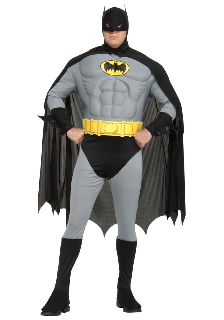 a man in a batman costume standing with his hands on his hips