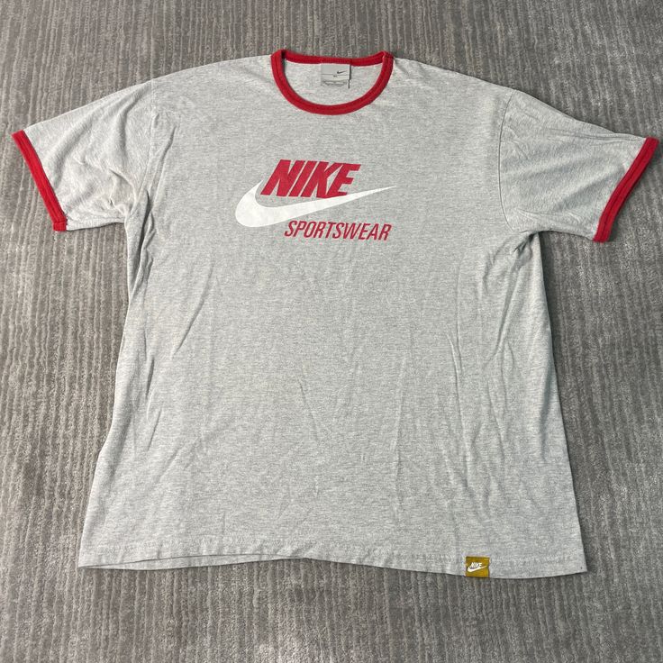 Vintage 2000s Nike Sportswear Athletic Swoosh Check Logo Streetwear Y2K Aesthetic Grey Graphic T Shirt Extra Large Mens Condition:  Excellent Used Condition  = No Flaws Measurements: Please see photos above for all measurements IF YOU BUY TWO OR MORE ITEMS USE THE CODE BUNDLE @ CHECK TO SAVE 20% WE SHIP WITHIN 24 HOURS AFTER PURCHASE! Please be aware that we do not offer free returns!! The Buyer is responsible for the cost of the return label.  Follow us on TikTok & Instagram @findsnostalgic and Casual Activewear With Logo Print For Streetwear, Graphic Print Activewear For Streetwear With Crew Neck, Sporty Logo Print Top For Streetwear, Sports T-shirt With Logo Print, Sporty Crew Neck Activewear For Streetwear, Casual Activewear With Graphic Print In Athletic Heather, Casual Athletic Heather Activewear With Graphic Print, Sporty Gray Top For Streetwear, Sportswear Tops For Streetwear