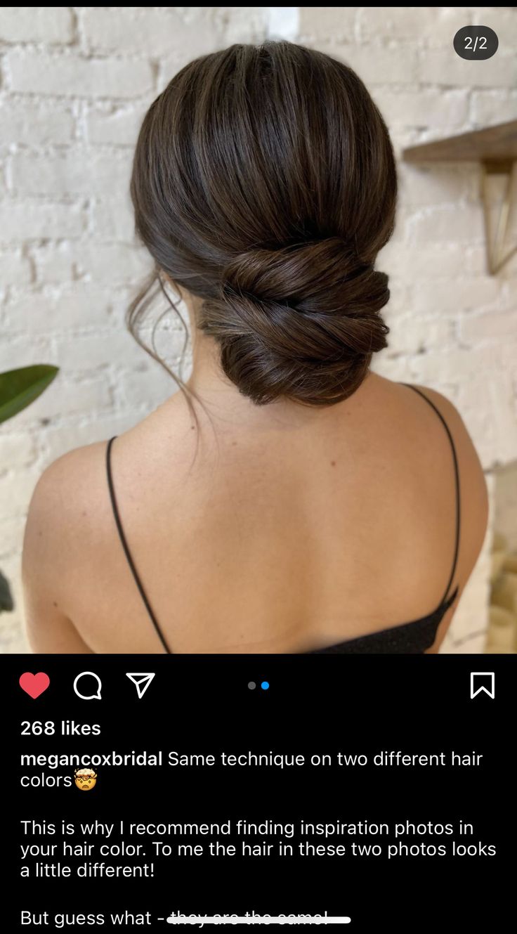 the back of a woman's head with her hair in a low bun