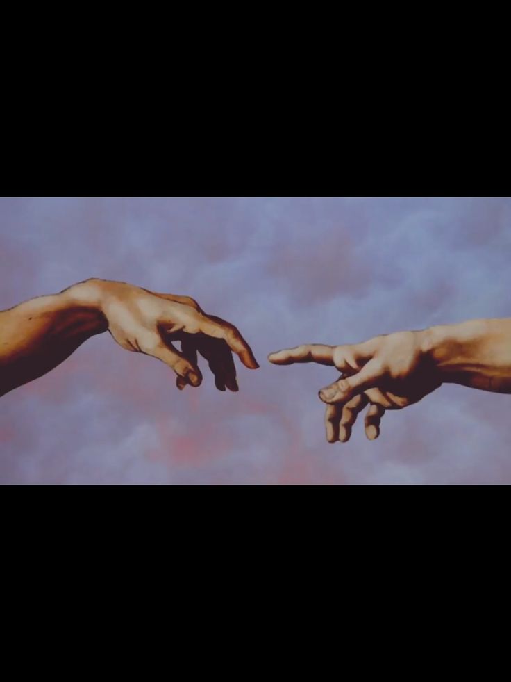 two hands reaching out towards each other in front of a blue sky with white clouds