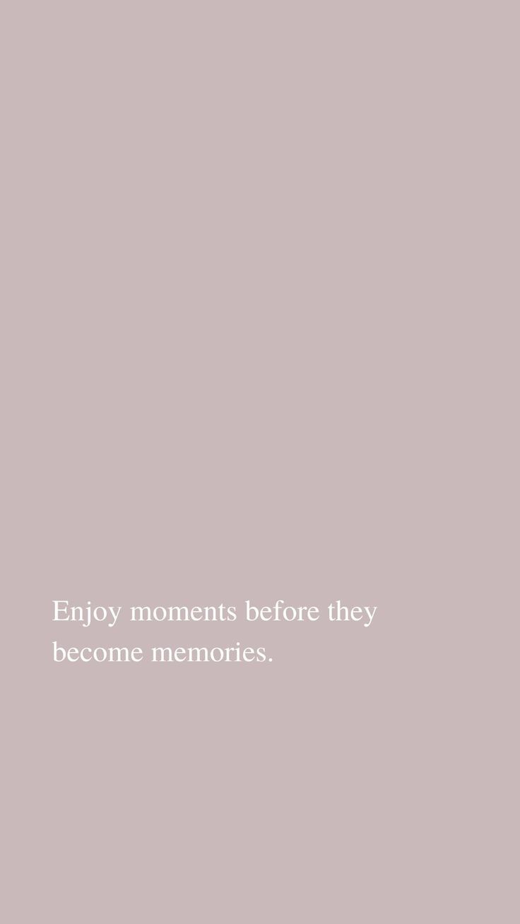 the words enjoy moments before they become memories are written in white on a gray background