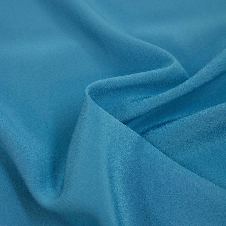 Demuja is a beautiful blue silk crepe de chine fabric, fluid and a great choice for tops, blouses, shirts, dresses and evening gowns. Composition: 100% SE Width: 138cm Colour: blue Pattern: solid Weight: 80gr/m2 Blue Satin Blouse For Formal Occasions, Elegant Blue Viscose Blouse, Blue Silk Evening Blouse, Blue Silk Blouse For Evening, Blue Silk Summer Blouse, Silk Material, Blue Silk, Silk Crepe, Blue Pattern