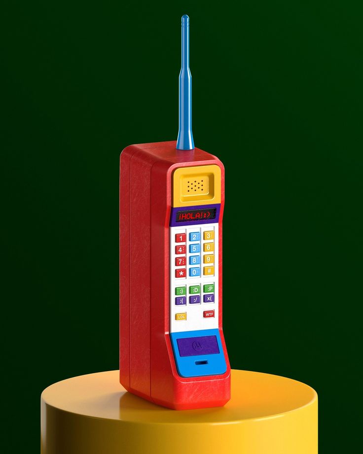 a toy phone sitting on top of a yellow table