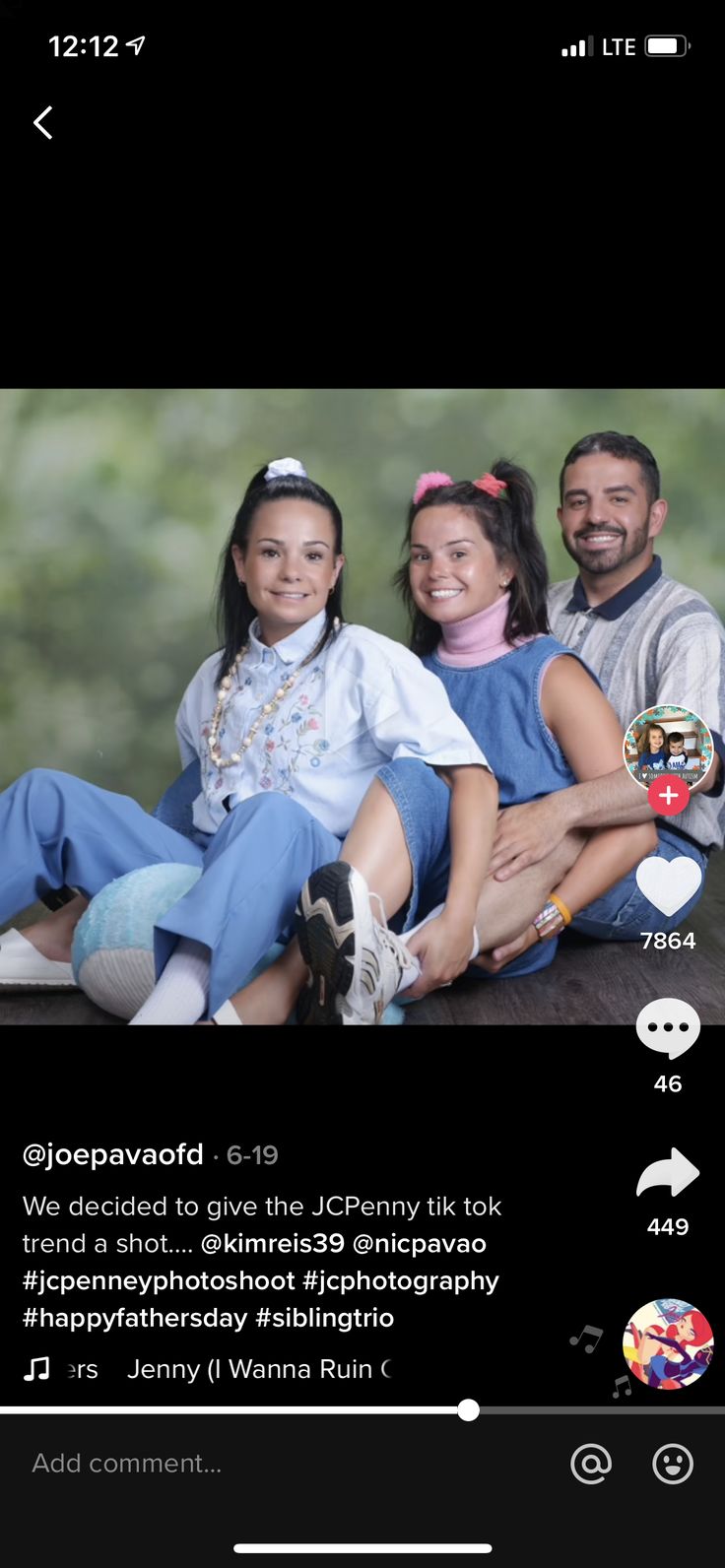 two people are sitting on the ground and one person is smiling