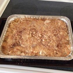 an uncooked casserole sitting on top of a stove in a pan