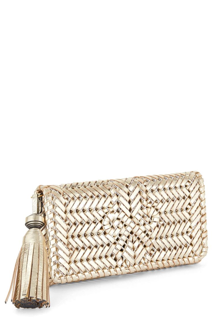 Anya Hindmarch neeson tassel clutch in platino. Features: Removable Wristlet Strap 100% Goat Leather Length: 23.5' Height: 12.5' Depth: 4' Made in China Elegant Clutch With Fringe, Luxury Formal Clutch With Tassels, Elegant Fringe Clutch For Formal Occasions, Elegant Fringe Clutch For Formal Events, Gold Woven Clutch, Elegant Woven Clutch, Formal Woven Clutch, Formal Clutch With Tassels, Elegant Evening Clutch With Tassels