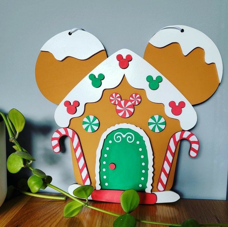 a gingerbread house is decorated with candy canes