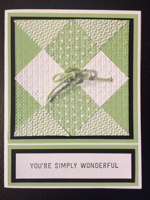 a green and white card with a knot on it's end that says, you're simply wonderful