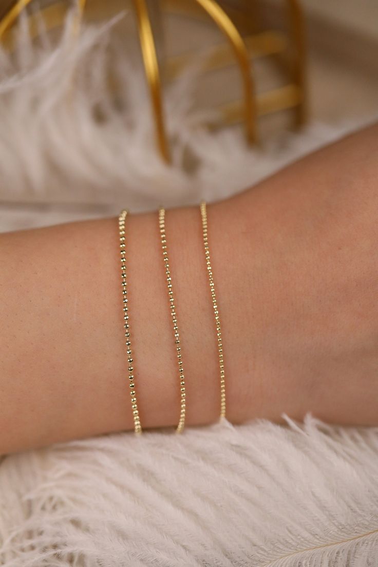 14k Gold Ball Chain Bracelet, Solid Gold Bracelet, Yellow Gold Dainty Chain, Bracelet Stack, Dainty Gold Bracelet, A Great Gift, Selena Wear it by itself or stack them up with your other bracelets ⁕⁕ Handmade ⁕⁕ Solid Gold ⁕⁕ Chain Width : 1mm - 1.3mm - 1.5mm ⁕⁕ High-End Polish Orders with free shipping go out with USPS First Class Mail tracking. We require a signature for orders more than $500. If you need a signature required service, you can select that service in the shipping options on your Delicate Chain Bracelets For Parties, Elegant Charm Bracelet With Adjustable Chain And Round Beads, Elegant Party Bracelets With Beaded Chain, Dainty Box Chain Bracelet, Dainty Beaded Bracelet With Adjustable Chain, Elegant Beaded Chain Bracelets For Party, Gold Bracelets With Satellite Chain As Gift, Gold Bracelet With Chain And Round Beads, Gold Bracelets With Satellite Chain For Gift