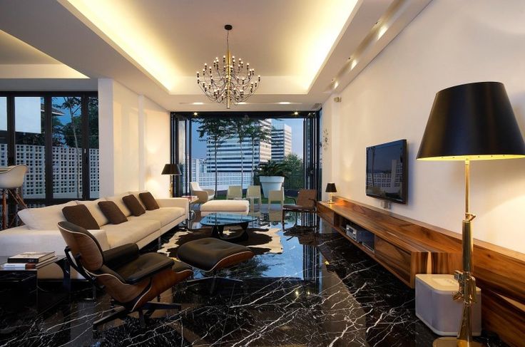 a living room filled with furniture and a flat screen tv