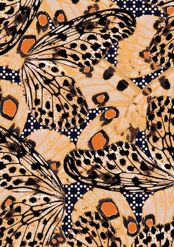 an orange and black butterfly pattern with spots on it's wings, as well as dots