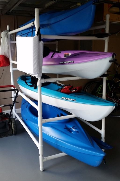 three kayaks are stacked on top of each other