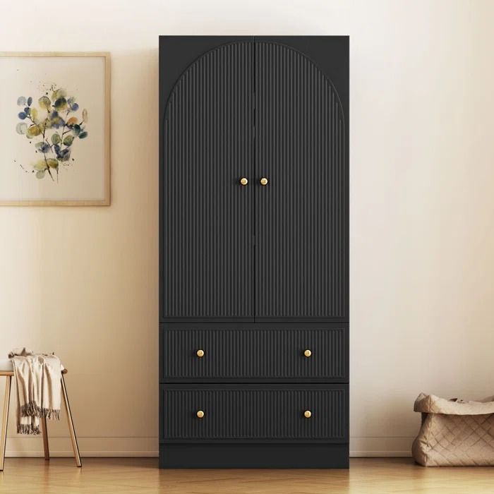 a tall black cabinet sitting in the corner of a room