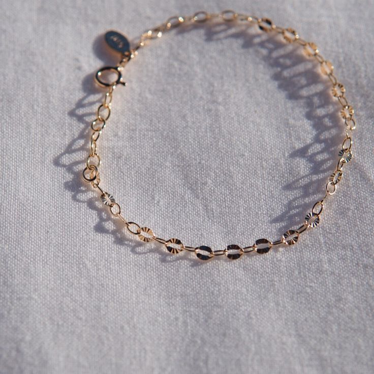 One of our newest chains! Every other link has a starburst imprinted✨ Perfect for layering! Lightweight for comfort and every day wear 14kt gold filled Minimalist 14k Gold Charm Bracelet With Delicate Chain, Everyday Rose Gold Bracelet Tarnish Resistant, Everyday Rose Gold Tarnish Resistant Bracelet, Dainty Cable Chain Bracelet, Dainty Rose Gold Tarnish Resistant Charm Bracelet, Everyday 14k Rose Gold Bracelet, 14k Gold-filled Adjustable Chain Charm Bracelet, 14k Gold Filled Tarnish Resistant Charm Bracelet, Dainty Gold Charm Bracelet With Adjustable Chain