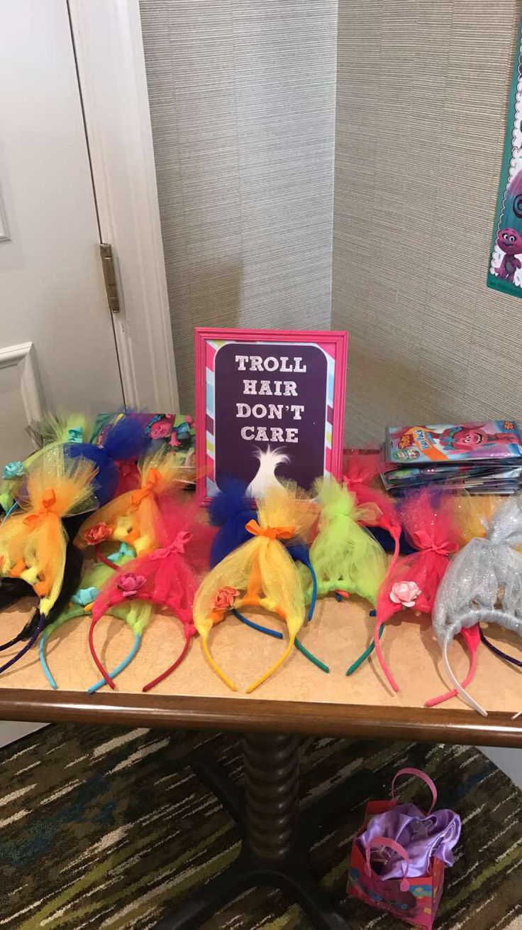 a table topped with lots of colorful hair accessories