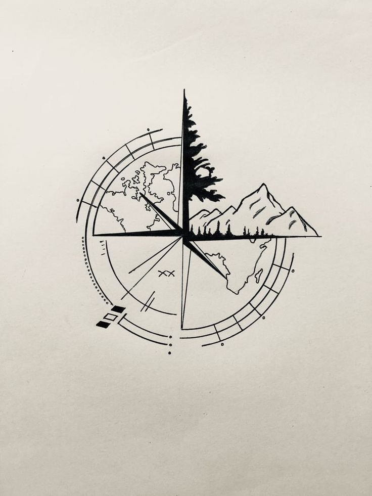 a compass with trees and mountains in the middle is drawn by hand on white paper