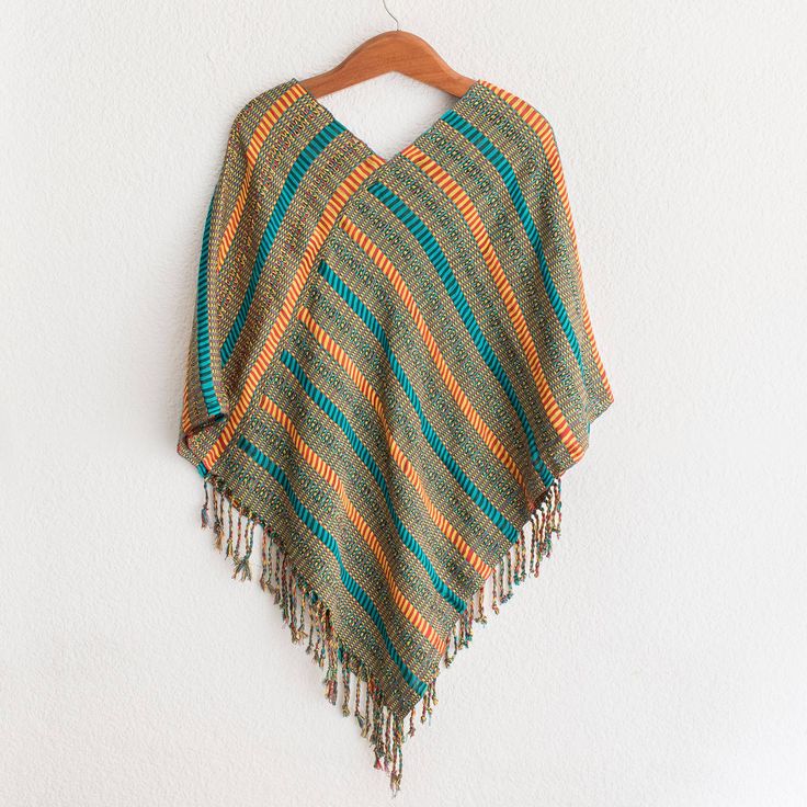 Evoking the colors of the beach stripes of turquoise daffodil strawberry and pine green are created with cotton yarns that are carefully woven together by hand. Guatemala's Elena Ixtamer creates this artisanal poncho which culminates in a pointed bottom that is accented by dangling fringes. Backstrap Loom, Gift Suggestions, Pine Green, Premium Gift, Guatemala, Cotton Yarn, Fashion Casual, Crochet Top, The Beach