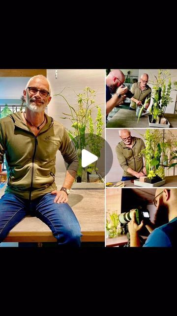 a man sitting on top of a table next to plants