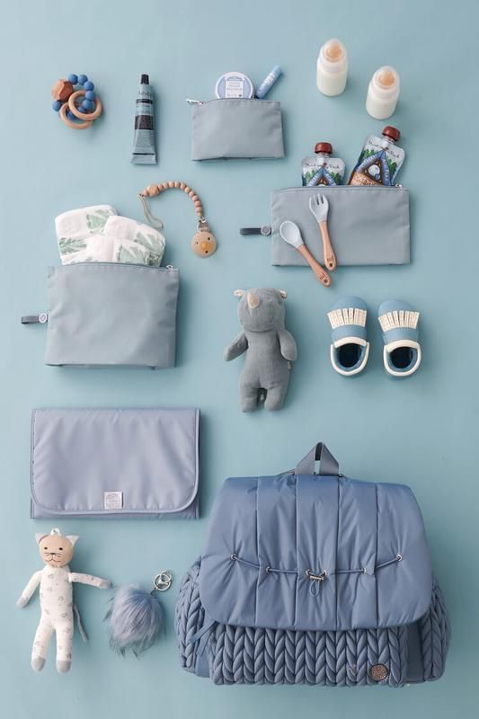 the contents of a baby's diaper laid out on a blue background