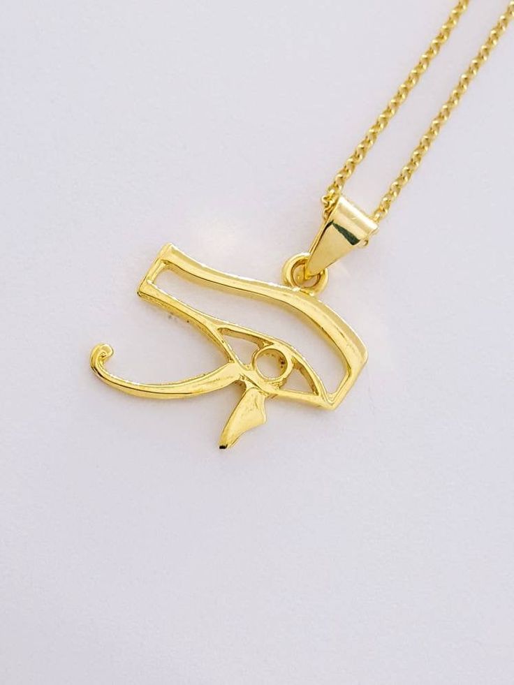 "Gold Eye of Horus Necklace, 14k Gold Vermeil Over Sterling Silver Egyptian Necklace, 3 Sizes of Gold Eye Charm or Pendant. Eye of Horus, in ancient Egypt, a symbol representing protection, health, and restoration. According to Egyptian myth, Horus lost his left eye in a struggle with Seth. The eye was magically restored by Hathor, and this restoration came to symbolize the process of making whole and healing. For this reason, the symbol was often used in amulets. * Material: Eye Of Horus neckla Gold Pendant Jewelry In Vintage Style, Gold Antique Pendant Jewelry, Ancient Style Engraved Gold Necklace, Gold Ancient Style Engraved Necklace, Ancient Style Gold Engraved Necklace, Ancient Gold Pendant Jewelry, Antique Gold Ankh Jewelry, Ancient Style Gold Pendant Jewelry, Horus Necklace