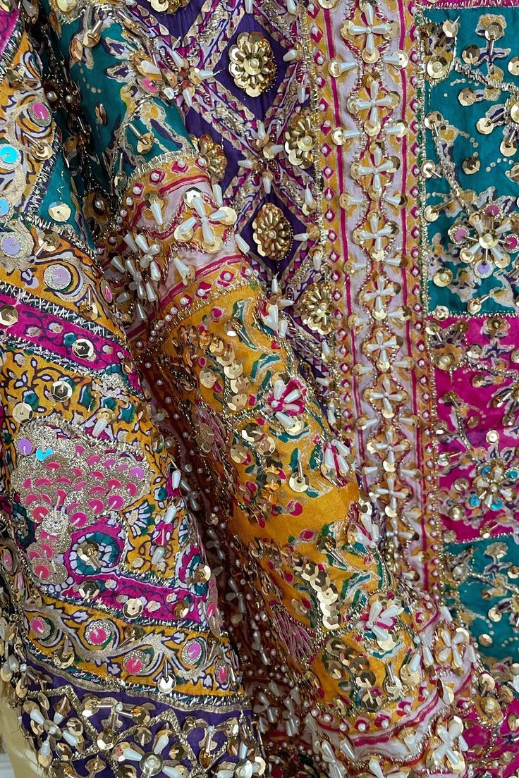 This Multicolor Heavy Embroidered Handwork Pakistani Silk Dupatta with Lining is a stunning piece with intricate handwork of sequins and pearls, a gold lined back and vibrant multi-color block print. Its 2.5 meter size makes it perfect to pair with a Lehenga or Salwar Suit. Stunning and unique, this item is ready to ship from California. Material: Silk Color: Multicolor Pattern: Floral, Block Screen Print Work: Handcrafted sequins, beads, embroidery & pearl work Size: 2.5 meter Condition: New Oc Embroidered Dupatta Heavy, Pakistani Bridal Dupatta, Phulkari Pants, Lucknowi Kurta, Patiala Salwar Suits, Bridal Dupatta, Phulkari Dupatta, Pearl Work, Pakistani Party Wear