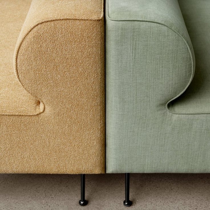 two different colored couches sitting next to each other