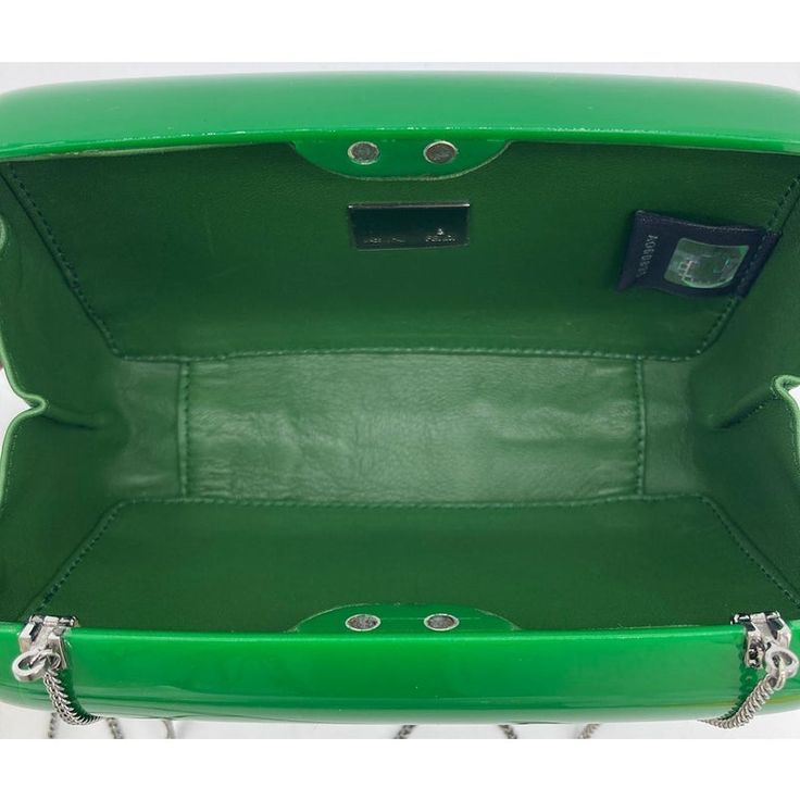 Fendi Green Logo Box Clutch in good condition. Green hard acrylic with matching green leather logo along front side. Magnetic closure. Green leather interior with attached chain shoulder strap. Overall good condition. One crack in acrylic on front right corner- see photo for detail. Very light scuffs on interior leather. Purchase includes care booklet. measurements: 7x4.5x2" 21.5" strap drop Box Clutch, Green Logo, Evening Clutch Bag, Leather Logo, Green Leather, Leather Interior, Magnetic Closure, Shoulder Strap, Fendi