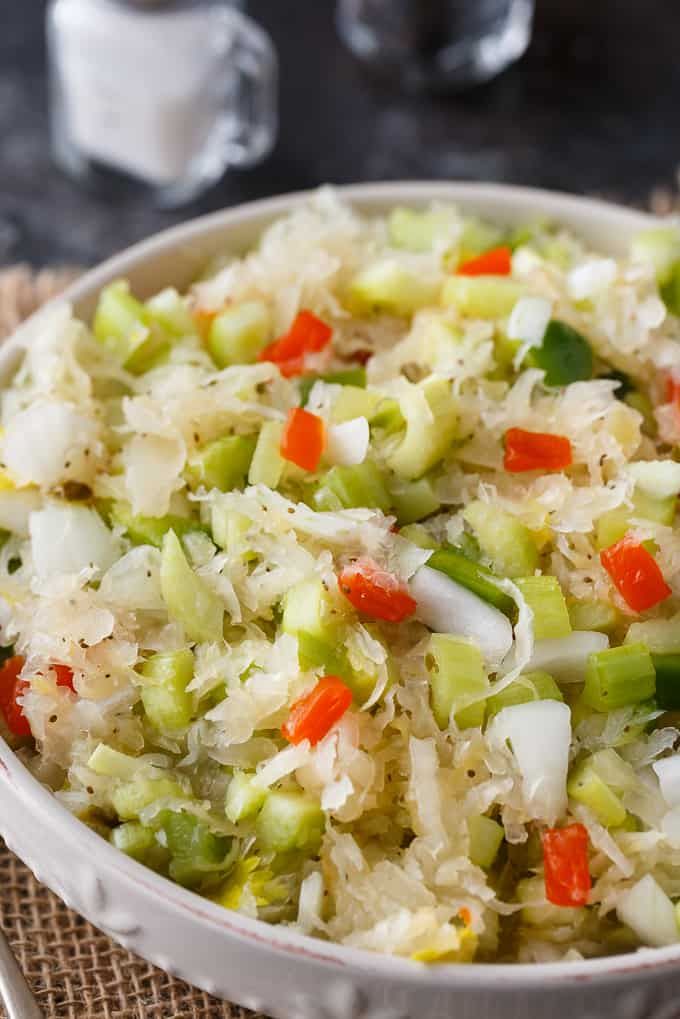 a white bowl filled with rice and vegetables