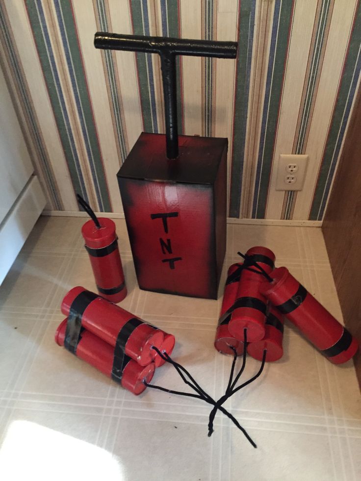 four red fire extinguishers sitting on the floor