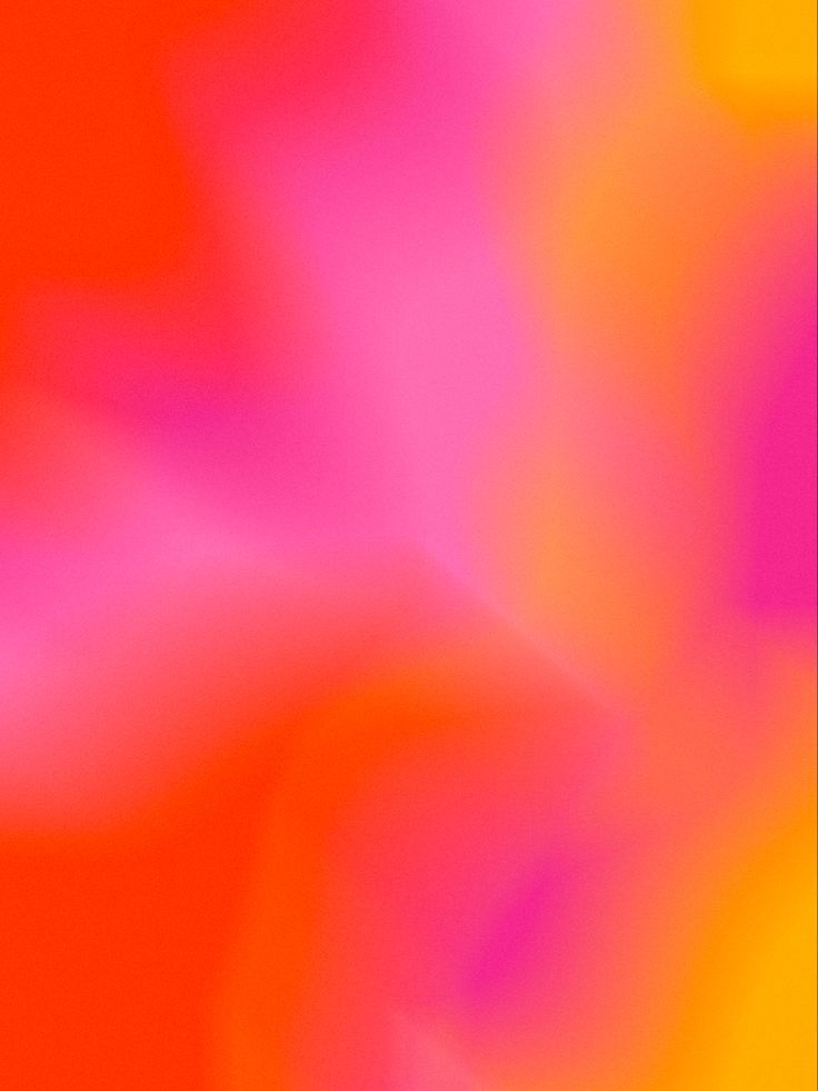 blurry image of an orange and pink flower