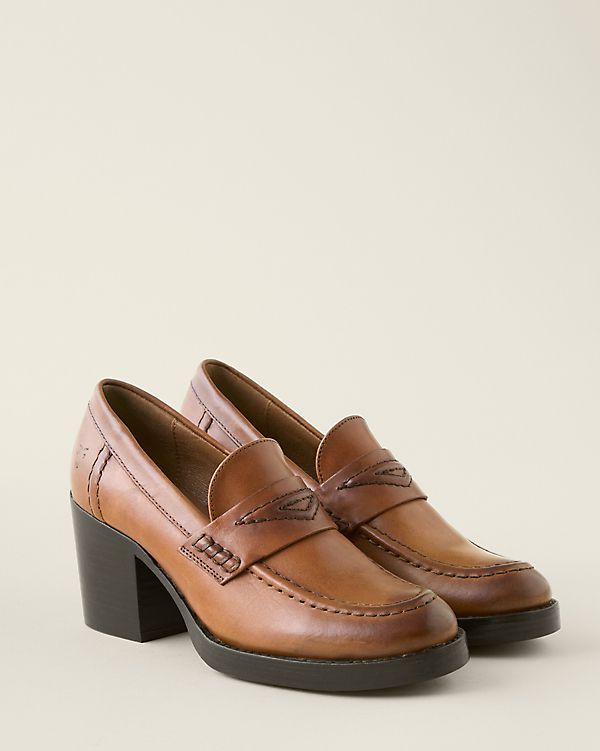 This menswear-inspired loafer gets a feminine lift from its fabulously heeled silhouette. Handcrafted in burnished leather with cushioning for comfort, plus raised heritage stitching on the toe, saddle, and back for extra style.  By Frye. Slip-on style. Cushioned footbed. Stacked leather block heel. Leather sole and man-made heel cap. Fall Loafers With Stacked Heel And Almond Toe, Stacked Heel Almond Toe Loafers For Fall, Almond Toe Loafers With Stacked Heel For Fall, Fall Almond Toe Loafers With Stacked Heel, Fall Workwear Loafers With Reinforced Heel, Vintage Loafers For Work In Fall, Vintage Loafers For Workwear In Fall, Fall Wingtip Platform Loafers For Work, Classic Leather Platform Loafers Medium Width