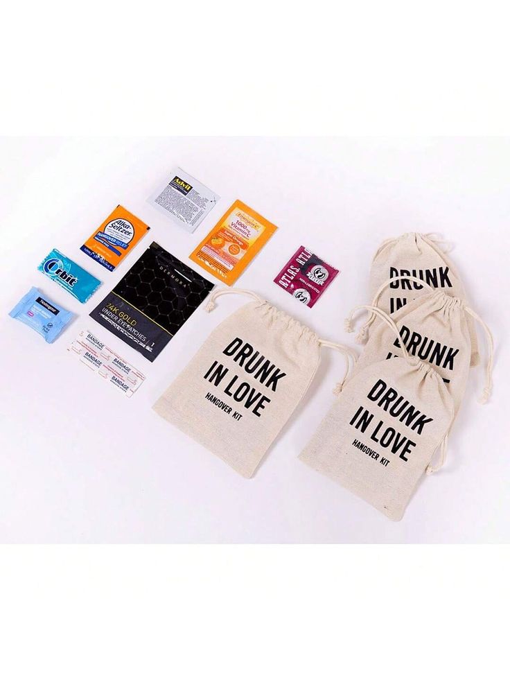 various stickers, tags and bags on a white surface with the words drink in love