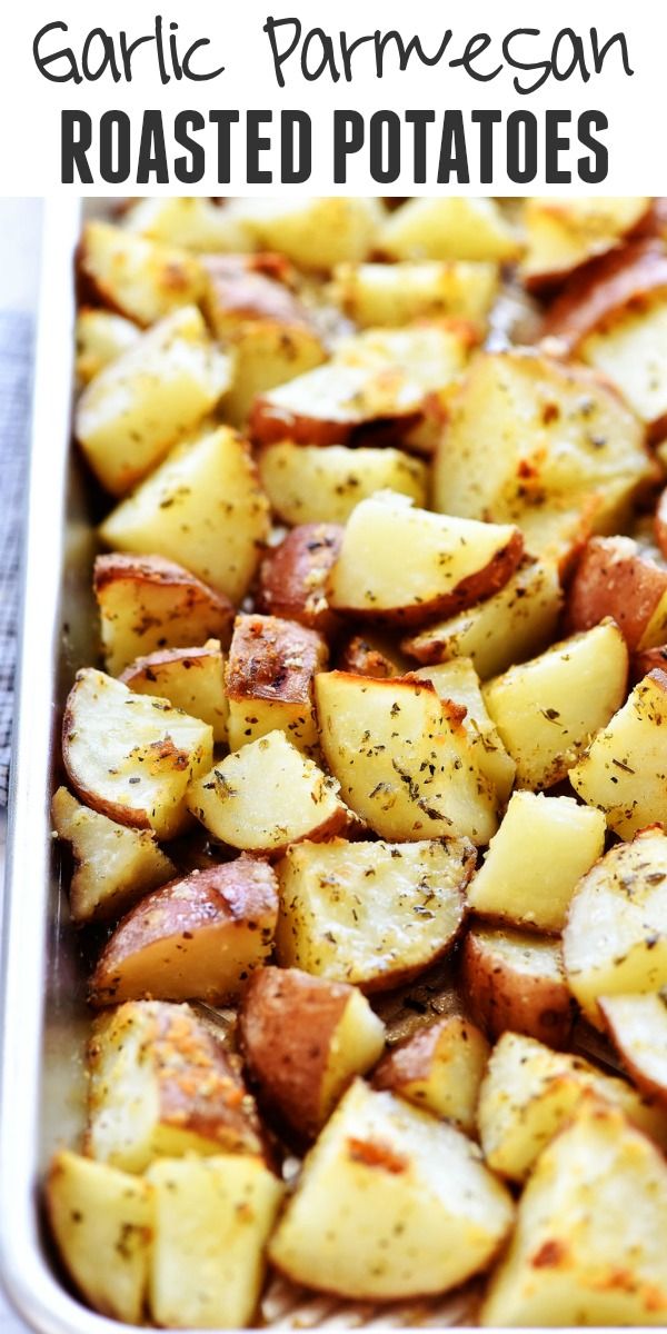 garlic parmesan roasted potatoes in a baking pan with text overlay that reads garlic parmesan roasted potatoes