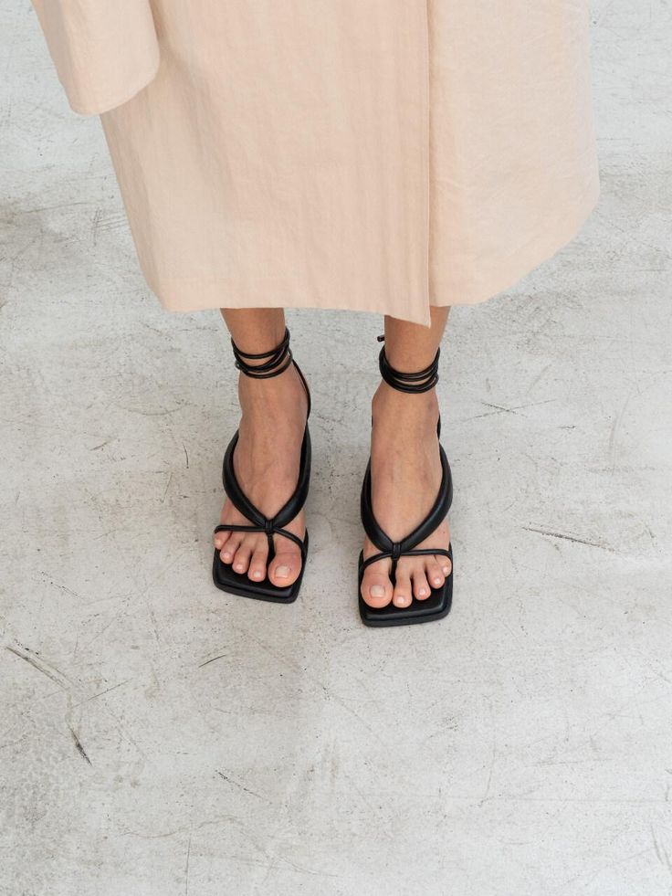 - Square toe- Self-tie strappy sandal- Bold flip flop strap- French mid heelMeasurements- Heel: 2.3- Size: KR225(US5.5)-KR250(US8)- This item is based on the KR shoe size. Please refer to the size chart.- This item runs true to size. For wide feet, please order half size larger than your normal size.Composition & Care- Upper: Sheep leather- Midsole: Sheep Leather- Insole: Synthetic LeatherDesigner- Made in Korea- by CHIELEI- Style#: 300905777 Spring Evening T-strap Toe Post Sandals, Chic T-strap Sandals With Heel Strap, Chic Sandals With Toe Loop And Strap, Chic Toe Loop Sandals With Strap, Chic T-strap Sandals With Heel And Toe Post, Summer Strappy Lace-up Sandals With Heel Loop, Strappy Lace-up Sandals With Heel Loop For Summer, Strappy Lace-up Sandals With Heel Loop, Summer T-strap Toe Loop Sandals With Heel Strap