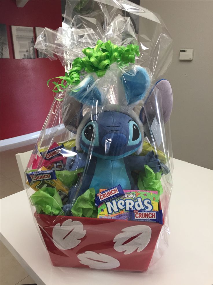 a stuffed animal in a basket on a table