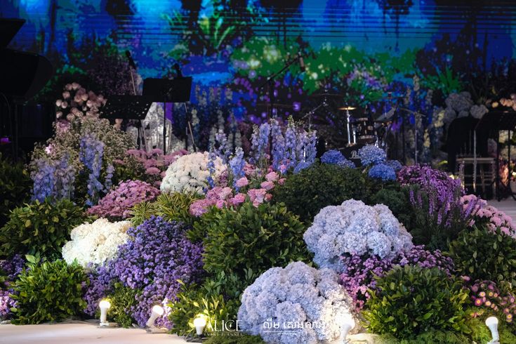 the stage is decorated with flowers and candles